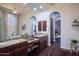 Primary bath showcases dual sinks, decorative mirrors and lighting with a large walk-in shower at 3634 E Sands Dr, Phoenix, AZ 85050