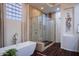 Spacious bathroom features a freestanding tub, glass shower, and elegant tile work at 3634 E Sands Dr, Phoenix, AZ 85050