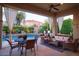 Inviting covered patio with outdoor seating, a dining table, and views of the sparkling pool at 3634 E Sands Dr, Phoenix, AZ 85050