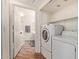 Well-lit laundry room and adjacent bathroom, with a washer and dryer at 3848 N 3Rd Ave # 1047, Phoenix, AZ 85013