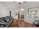 Open living room concept with wood flooring and view of dining area at 3848 N 3Rd Ave # 1047, Phoenix, AZ 85013
