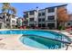 Resort-style community pool and spa with nearby lounging, nestled between apartment buildings at 3848 N 3Rd Ave # 1047, Phoenix, AZ 85013