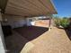 Cozy backyard area featuring a covered patio and rock landscaping for easy maintenance at 3932 W Lawrence Ln, Phoenix, AZ 85051