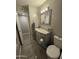 This bathroom features a vanity and toilet at 3932 W Lawrence Ln, Phoenix, AZ 85051