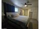 Comfortable bedroom with a ceiling fan, closet and an ample amount of storage available at 3932 W Lawrence Ln, Phoenix, AZ 85051