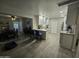 Bright kitchen with white cabinets, modern appliances, and eat in breakfast nook at 3932 W Lawrence Ln, Phoenix, AZ 85051