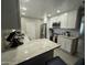Well-equipped kitchen featuring granite countertops, stainless steel appliances, and ample cabinet space at 3932 W Lawrence Ln, Phoenix, AZ 85051