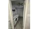 Clean laundry room with modern appliances, tile floors and built-in storage at 3932 W Lawrence Ln, Phoenix, AZ 85051