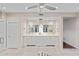 Bright bathroom with dual sink vanity, granite counters, tile floor and stylish lighting at 4066 E Grandview St, Mesa, AZ 85205