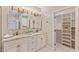 Bathroom features double sinks, granite counters, and a closet for extra storage at 4066 E Grandview St, Mesa, AZ 85205