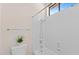 Bathroom featuring a shower-tub combo with tiled walls, a toilet, and a decorative plant at 4066 E Grandview St, Mesa, AZ 85205