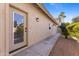The exterior of the home features a glass door and stucco siding at 4066 E Grandview St, Mesa, AZ 85205