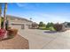 Spacious home featuring a three car garage and beautiful landscaping at 4066 E Grandview St, Mesa, AZ 85205