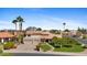 Charming two-story home featuring a three-car garage and a well-manicured lawn with mature trees at 4066 E Grandview St, Mesa, AZ 85205