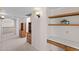 Upstairs hallway with wood cabinets, a built-in desk and chair, and carpeted floors at 4066 E Grandview St, Mesa, AZ 85205