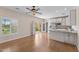 Bright kitchen features white cabinets, stainless appliances, granite counters, and outdoor access at 4066 E Grandview St, Mesa, AZ 85205