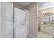 Convenient laundry room featuring washer, dryer, and cabinets for extra storage at 4066 E Grandview St, Mesa, AZ 85205