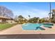 A refreshing backyard pool and spa surrounded by lush greenery and landscaping at 4066 E Grandview St, Mesa, AZ 85205