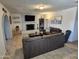 Comfortable living room featuring neutral paint, fireplace, tile flooring, and comfortable seating at 4231 E Roeser Rd, Phoenix, AZ 85040