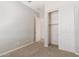 Neutral bedroom with carpeted floors, a closet with sliding doors, and an ensuite bathroom entrance at 4444 E Bethena St, Gilbert, AZ 85295