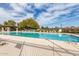 Sparkling community pool with lounge chairs and shade trellis offers a relaxing oasis at 4444 E Bethena St, Gilbert, AZ 85295