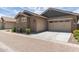 Charming home exterior with an attached two-car garage, neutral paint scheme, and drought-tolerant landscaping at 4444 E Bethena St, Gilbert, AZ 85295