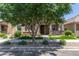 Attractive home exterior featuring stone veneer, updated landscaping, and a well-kept lawn at 4444 E Bethena St, Gilbert, AZ 85295