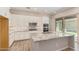 Elegant kitchen island features granite countertops, stainless steel appliances and custom cabinets at 4444 E Bethena St, Gilbert, AZ 85295