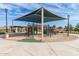 Community playground featuring a covered play structure, seating, and walking paths at 4444 E Bethena St, Gilbert, AZ 85295