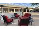 Inviting patio with red cushioned seating and tables, perfect for relaxing outdoors at 4701 E Walatowa St, Phoenix, AZ 85044