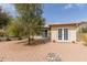 Charming backyard features desert landscaping, creating a serene outdoor space at 4701 E Walatowa St, Phoenix, AZ 85044
