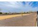 View of the backyard, showcasing desert landscaping and open space with neighborhood views at 4701 E Walatowa St, Phoenix, AZ 85044
