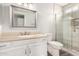 Bathroom features a large mirror, a walk-in shower and a cream colored vanity at 4701 E Walatowa St, Phoenix, AZ 85044
