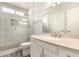 Bathroom boasts tiled walk-in shower and a cream colored vanity at 4701 E Walatowa St, Phoenix, AZ 85044