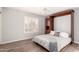 Bedroom features stylish wood-look flooring, a Murphy bed and window with shutters at 4701 E Walatowa St, Phoenix, AZ 85044