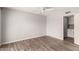 Bedroom features wood-look flooring, light gray walls and an overhead fan at 4701 E Walatowa St, Phoenix, AZ 85044