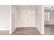 Inviting foyer with a double-door entry, light gray walls, and wood-look tile flooring at 4701 E Walatowa St, Phoenix, AZ 85044