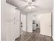 Hallway featuring wood-look tile flooring, storage and access to the laundry room at 4701 E Walatowa St, Phoenix, AZ 85044