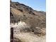 Hikers walking along a gravel trail amidst desert vegetation and mountainous terrain at 4701 E Walatowa St, Phoenix, AZ 85044