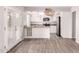 Eat-in kitchen with white cabinets, granite countertops, stainless steel appliances, and modern lighting at 4701 E Walatowa St, Phoenix, AZ 85044