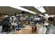 Spacious woodworking shop featuring multiple workstations, tools, and ample lighting at 4701 E Walatowa St, Phoenix, AZ 85044