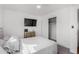Bedroom featuring television, closet, and a cabinet with shelving at 5525 E Thomas Rd # K6, Phoenix, AZ 85018