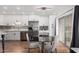 Kitchen and dining area showcasing stainless steel appliances, granite countertops, and tile flooring at 5525 E Thomas Rd # K6, Phoenix, AZ 85018