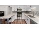Updated kitchen features granite countertops, stainless steel appliances, and modern cabinetry at 5525 E Thomas Rd # K6, Phoenix, AZ 85018