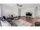 Living area features tile flooring, modern sofas, a ceiling fan, and a TV set-up at 5525 E Thomas Rd # K6, Phoenix, AZ 85018