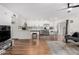 Bright living room featuring wood flooring, white walls, modern furnishings and stainless steel appliances at 5525 E Thomas Rd # K6, Phoenix, AZ 85018