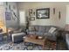 Comfortable living room with stylish decor, plush seating, and a patterned rug at 6026 E Vermillion Cir, Mesa, AZ 85215