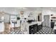 Open kitchen with granite island, stainless steel appliances, and seamless flow to dining and living spaces at 6527 W Bloomfield Rd, Glendale, AZ 85304