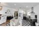 Well-equipped kitchen with granite countertops, stainless steel appliances, and an open layout to the living areas at 6527 W Bloomfield Rd, Glendale, AZ 85304