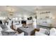 Open-concept living space with stylish decor, hardwood floors, and seamless flow to kitchen and dining areas at 6527 W Bloomfield Rd, Glendale, AZ 85304